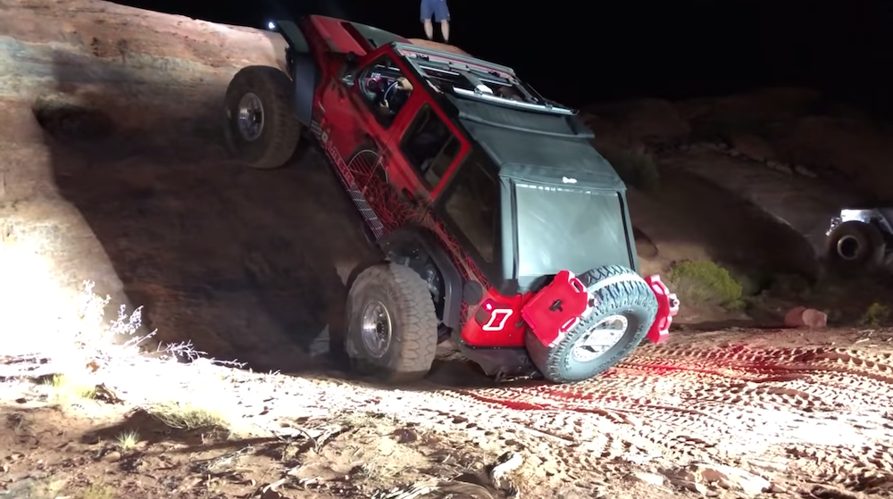 Lite Brite Nation's Hemi-Powered JL Wrangler Rubicon scaling a buggy wall. 