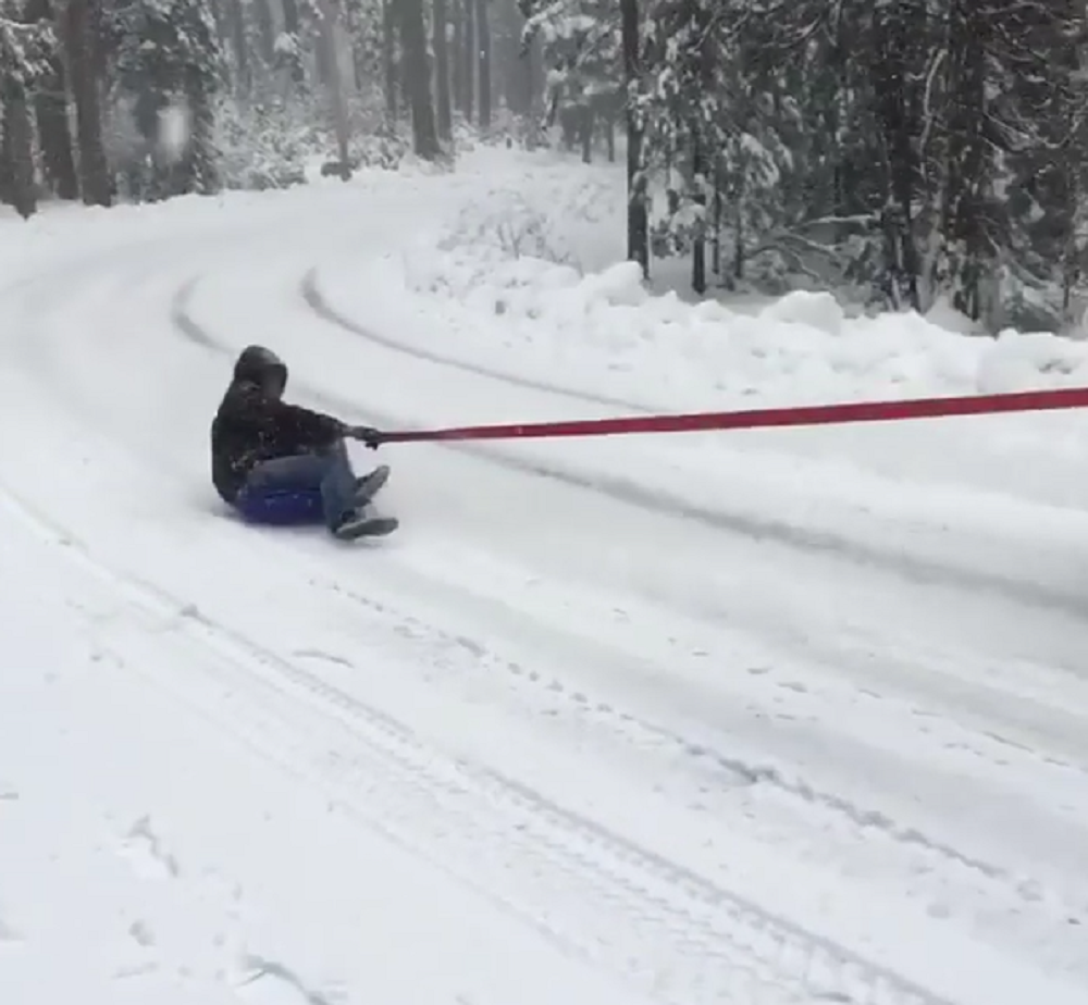 jk-forum.com Thrill-seeker Goes Sliding on the Snow - Behind a Jeep Wrangler!