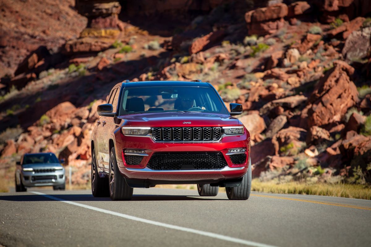 A 2024 Jeep Grand Cherokee driving with a Grand Cherokee following behind